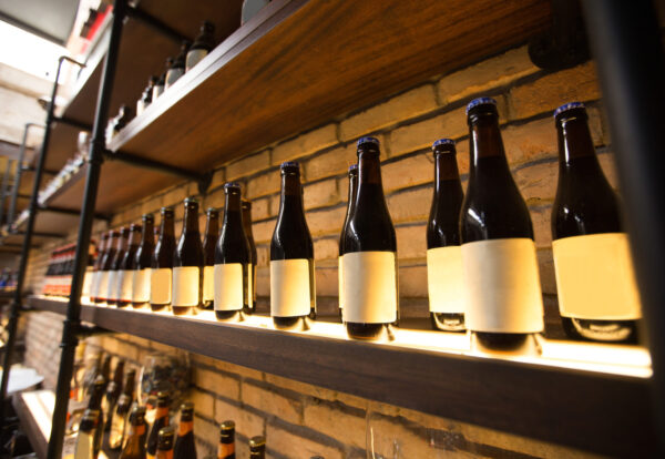 Closeup of shelves with bottles in pub
